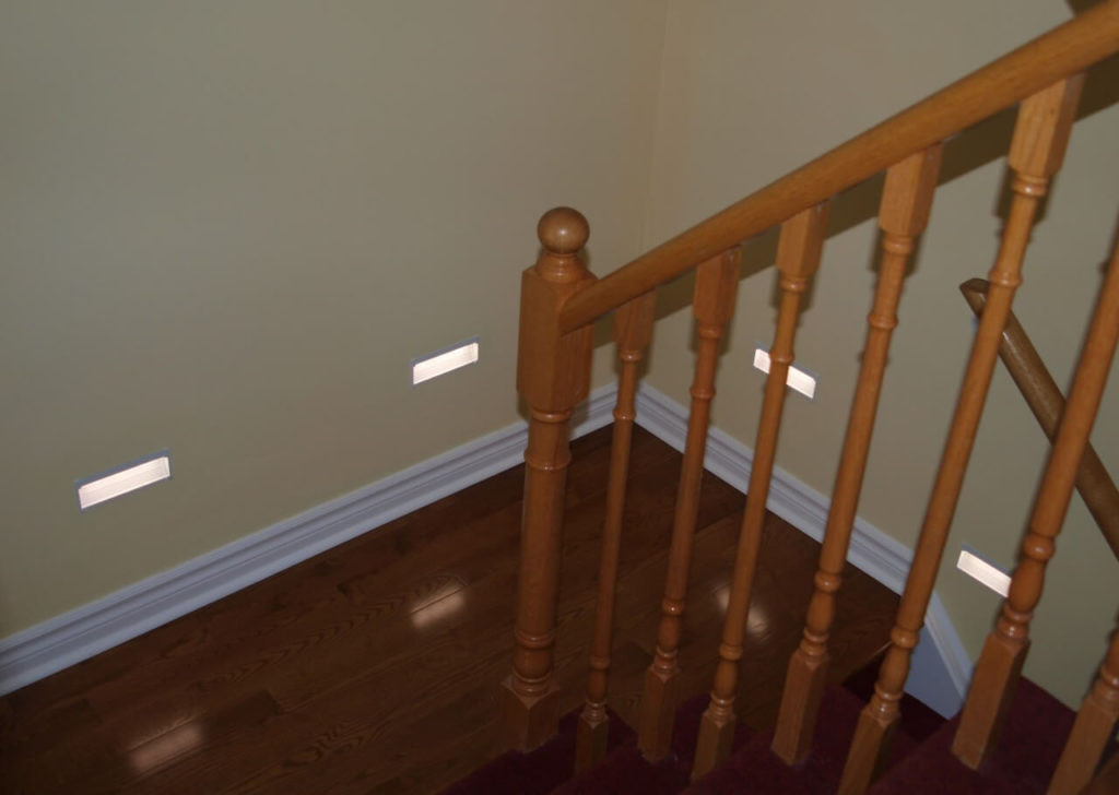 Rectangular recessed wall LED stair lighting on a modern staircase