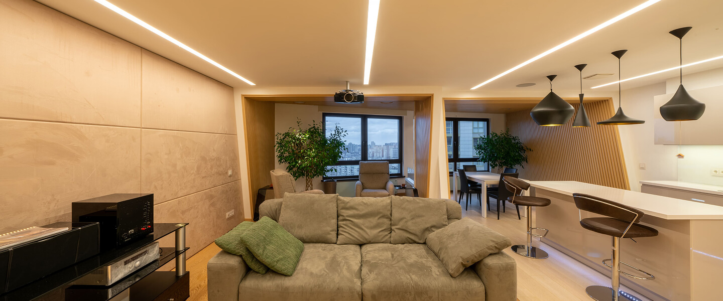 Modern living space with custom linear LED ceiling lighting
